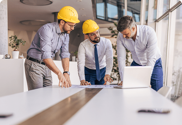 Construction meeting with professionals in hard hats