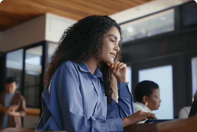 Professional woman using laptop indoors