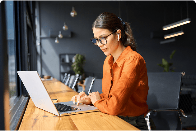 Professional woman wearing glasses and earbuds
