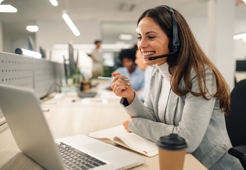 Customer service representative working on laptop